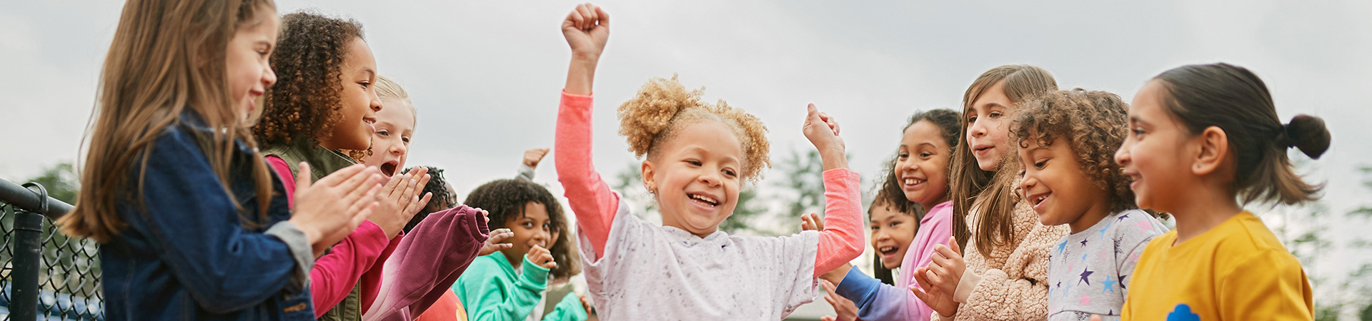  Group of Girl Scouts playing outdoors 
