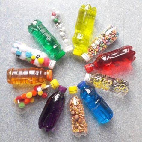 This may contain: there are many small bottles in the middle of this circle, each containing different types of candy