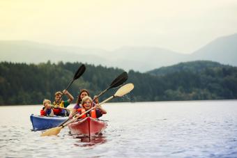 Parents and sons canoeing on lake