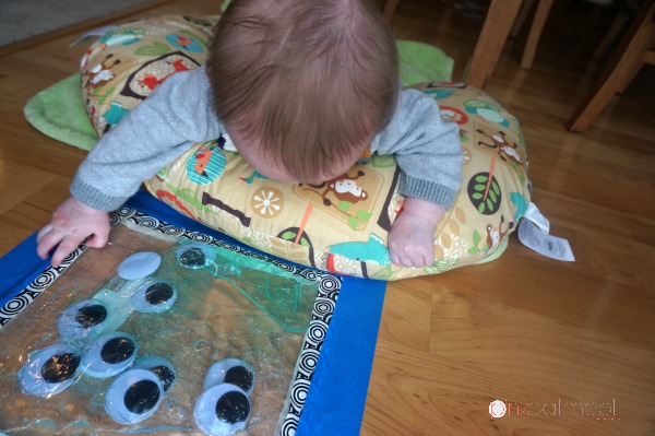 Tummy time sensory bag play! Such a fun baby play idea!