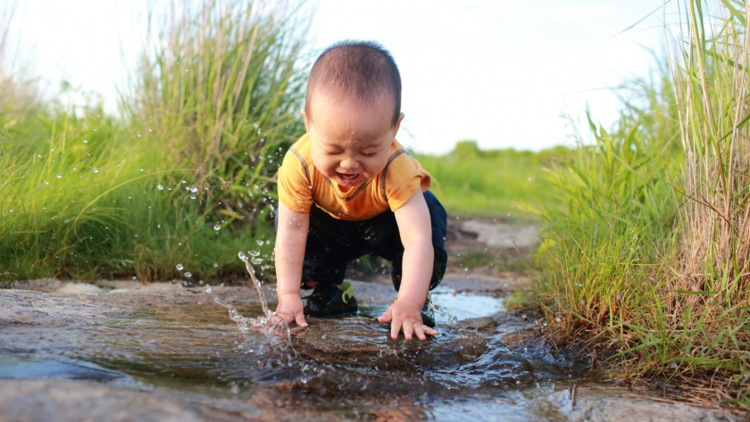 baby playing during the spring