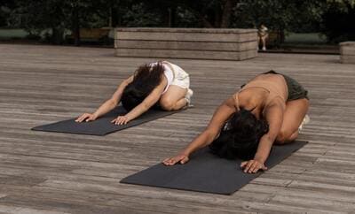 woman practicing yoga outdoors